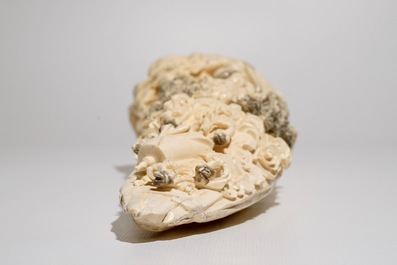 A Chinese carved ivory tusk with a marriage scene, ca. 1900